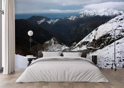 the mountains of the Apuan Alps covered with white snow in winter in Tuscany Wall mural