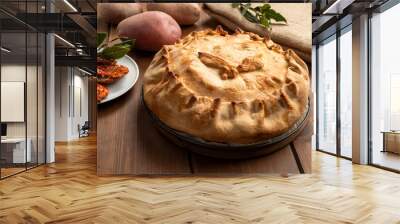 Panada, torta salata ripiena di carne di agnello e patate della cucina sarda tradizionale, cibo italiano  Wall mural