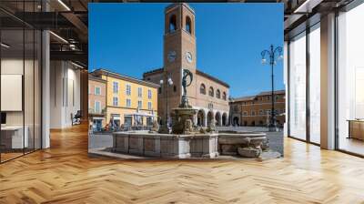 The beautiful central square of Fano with the historic palace of reason Wall mural