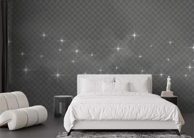 The dust sparks and golden stars shine with special light. Vector sparkles on a transparent background. Wall mural