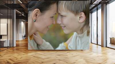 Beautiful mother with a boy on a walk Wall mural