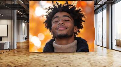 Black teenager boy on a outdoors background Wall mural