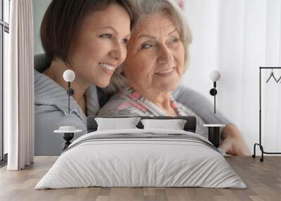 cheerful mother and adult daughter Wall mural