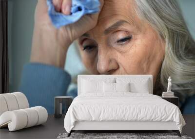 Close up portrait of a sick senior woman Wall mural