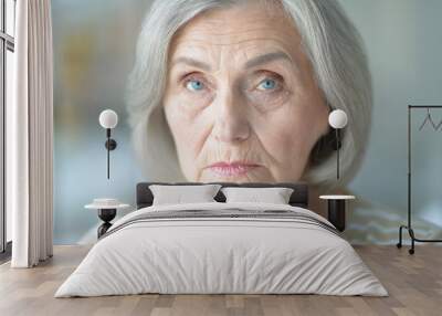 Close up portrait of sad senior woman Wall mural