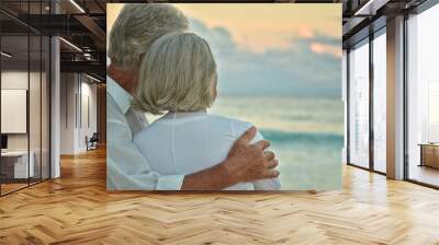 elderly couple rest at tropical beach Wall mural