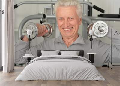 Elderly man in  gym Wall mural