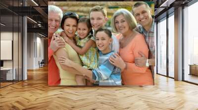 Family relaxing at resort Wall mural