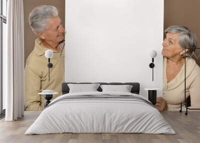 old age couple holding Wall mural