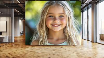 Portrait of a beautiful little girl looking at the camera Wall mural