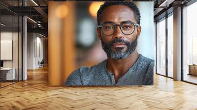 Portrait of an attractive dark-skinned man wearing glasses Wall mural