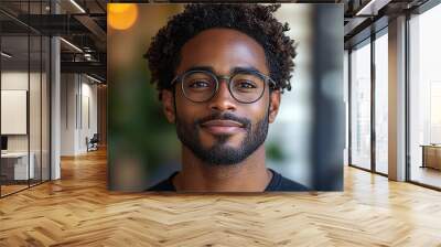 Portrait of an attractive dark-skinned man wearing glasses Wall mural