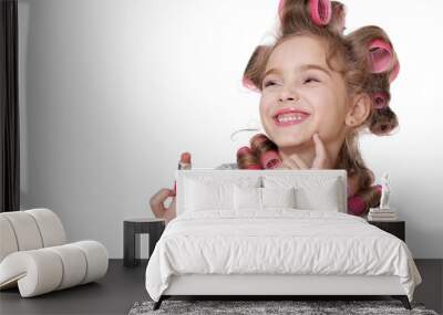 portrait of  little pretty girl with hair curlers with lipstick Wall mural