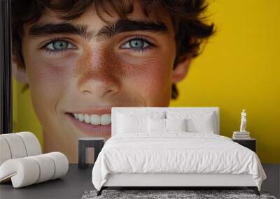 Portrait of smiling white cute teenage boy Wall mural