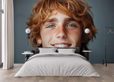 Portrait of smiling white cute teenage boy Wall mural