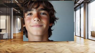 Portrait of smiling white cute teenage boy Wall mural