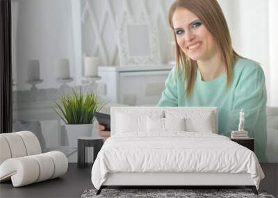 young woman using tablet  Wall mural