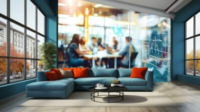 A blurred view through a glass wall into a bustling modern office, showcasing a team collaborating at a table with a whiteboard filled with handwritten notes Wall mural