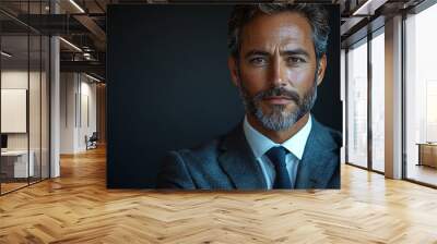 Close-up portrait of businessman standing on isolated dark background. Wall mural