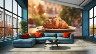 A freshly baked croissant on a table in a Parisian cafe Wall mural