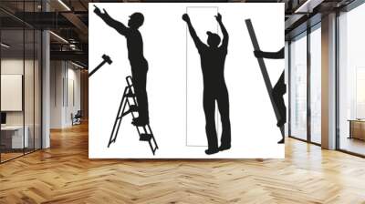 Builders. Silhouettes of workers and builders with tools in the workplace. Wall mural