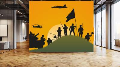 The importance of winning. Silhouettes of soldiers who won the battle against the background of the setting sun. Wall mural