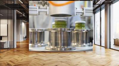 close up on Pesto sauce Industrial process. vacuum sealing machine for canned food. production of Pesto sauce. Vacuum Seamer for Cylindrical Cans of Rotary Type. Wall mural