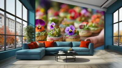 Female hands holding delicious canapes with edible flowers, closeup view generative ai Wall mural