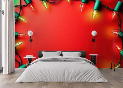 Festive lights frame on red background with copy space Wall mural