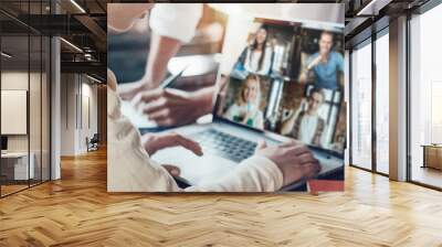 Office business team concept. Video conference using laptop with remote working teammates. Wide screen orientation Wall mural