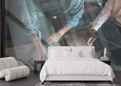 two young specialists working together in cozy loft office space. man and woman researching business Wall mural