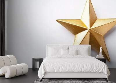 Golden star with textured surface on white Wall mural