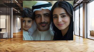 Happy Middle Eastern family posing together outdoors, showcasing tradition and unity with genuine smiles in a close-up portrait. Wall mural