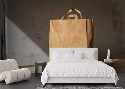 Disposable bag of kraft paper on a wooden table. Wall mural