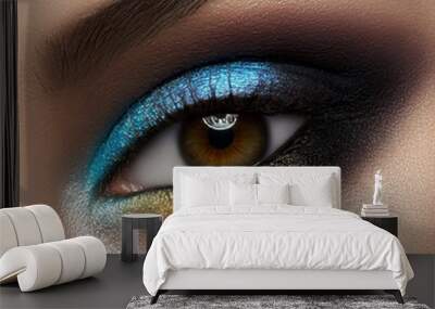 Macro and close-up creative make-up theme: beautiful female eye with blue and yellow shadows, black skin Wall mural