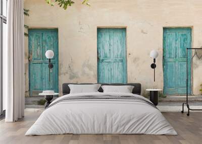 old turquoise doors against a beige wall Wall mural