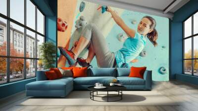 Woman training in climbing gym Wall mural