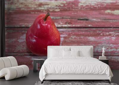 Red pear fruit (Pyrus L.) on wooden surface Wall mural