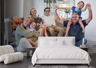 Happy, family and smile for love, care and playful happiness together in the living room at home. Portrait of people in joyful generations smiling and bonding fun with children and grandparents Wall mural