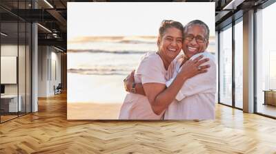 Senior couple, beach travel and hug by water of Dubai, happy on holiday for retirement and love by ocean. Portrait of elderly African man and woman hugging by sea during vacation with mockup space Wall mural