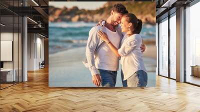 Travel, tourism and beach vacation with happy couple sharing hug, love and laughing while on holiday by the seaside. French man and woman enjoying exotic honeymoon having fun at tropical destination Wall mural