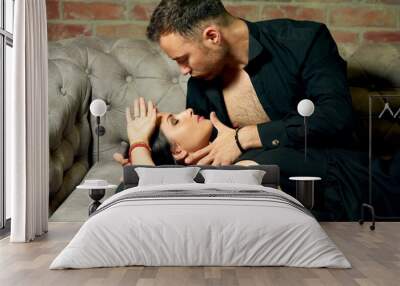 man with woman on sofa portrait Wall mural