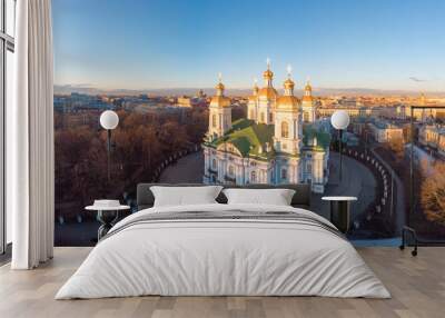 Aerial top view to St. Nicholas Naval Sea Cathedral in sunny day. Panorama of evening historical city center. Orthodox church located on banks of Kryukov and Griboyedov canal. Saint Petersburg. Russia Wall mural