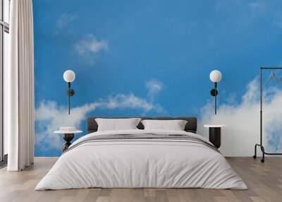 The vertical view of light blue sky with white clouds for background or texture. Copy space Wall mural