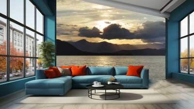 Vibrant sunset with beams of light Wall mural