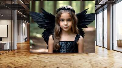 Portrait funny little girl in angel image with black wings in mysterious summer forest, looking at camera. Child in fairytale woodland. Vintage retro style, fantasy concept. Copy space for advertising Wall mural