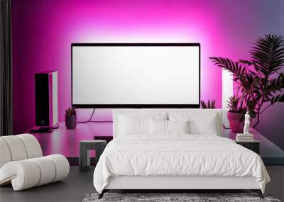 Screen monitor of personal gamer computer in living room at pink neon light. Monitor of pc stands on table at cozy home with modern design is neon lit. Advertising mock-up concept. Copy ad text space Wall mural