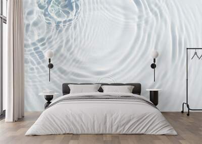 Water droplets fall on the transparent surface of the water in sunlight. Top view, flat lay Wall mural