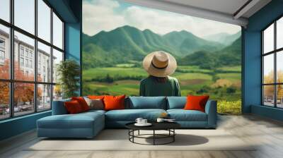 Woman traveler with hat and green tea plantation at doi angkhang mountain, Chiangmai, Thailand Wall mural