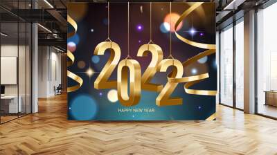 Happy New Year 2022. Hanging golden 3D numbers with ribbons and confetti on a defocused colorful, bokeh background. Wall mural